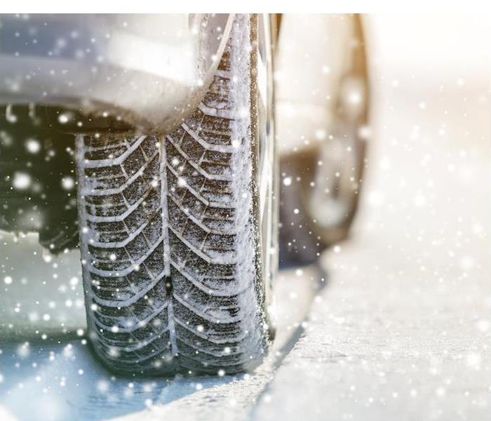 img src =”tire.jpg” alt = "a close-up image of a car and tire moving through snow ” >